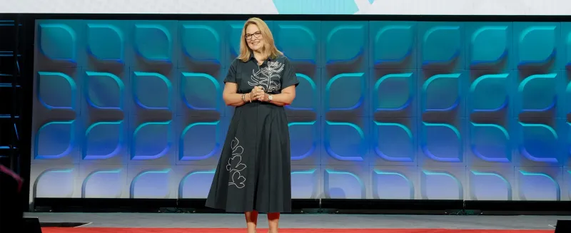 woman presenting on stage