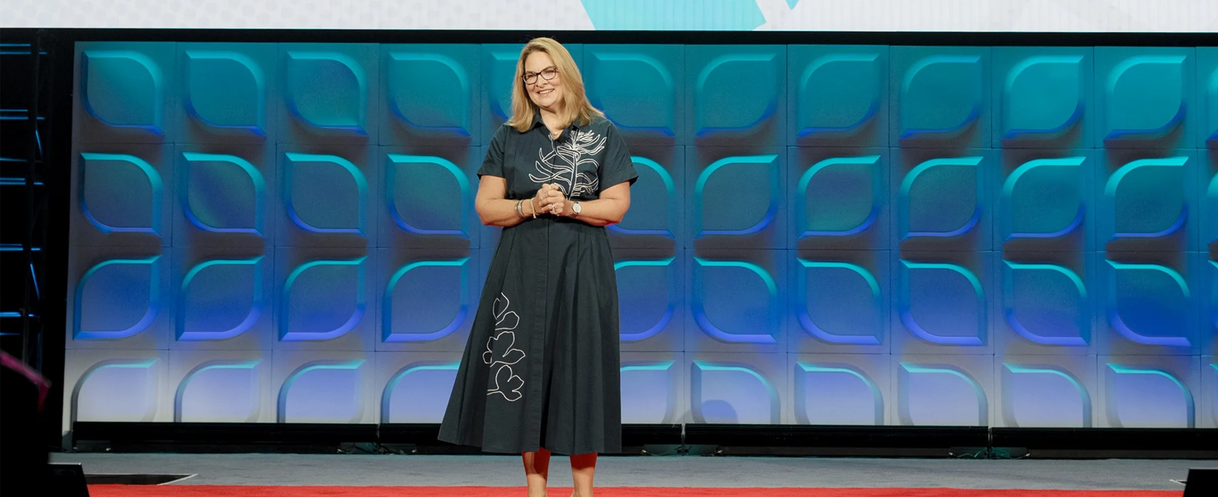 woman presenting on stage